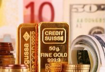 Vàng thế giới rút khỏi đỉnh trong phiên sau quyết định nâng lãi suất của Fed